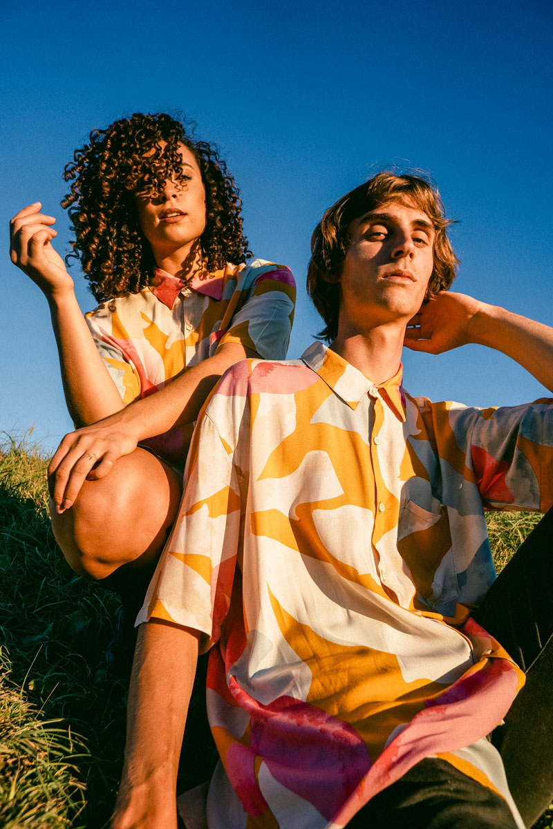 couple-wearing-button-up-front-shirt-yellow-pink-light-blue